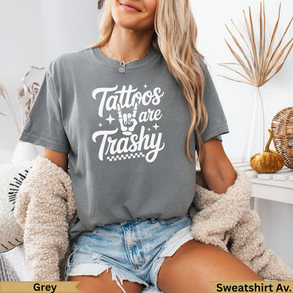 Grey t-shirt with "Tattoos are Trashy" text and a cozy cardigan.