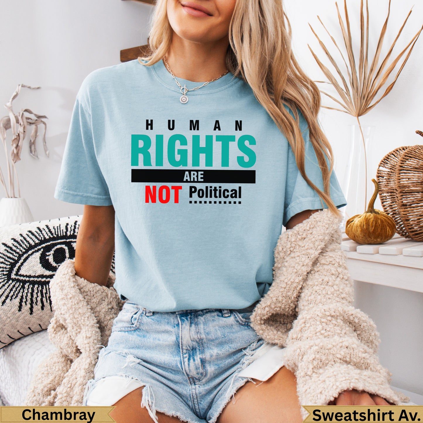 Light blue t-shirt with "HUMAN RIGHTS ARE NOT Political" text in black and red.