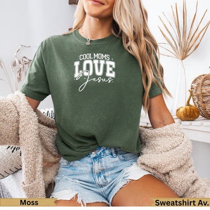 Green t-shirt with "Cool Moms Love Jesus" text.