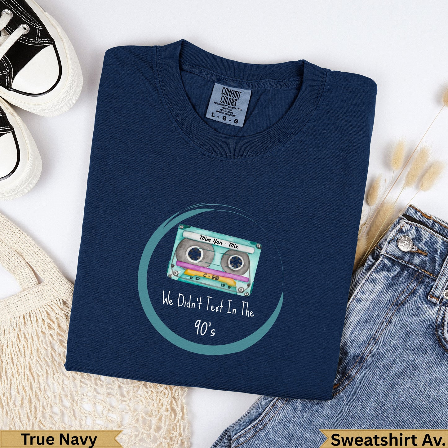 Navy sweatshirt with "We Didn't Text In The 90's" graphic and cassette tape.
