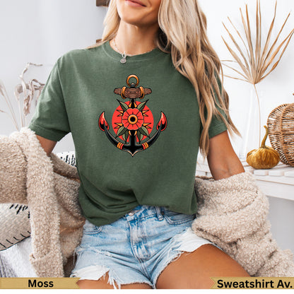 Anchor and sun tattoo design on olive green t-shirt.