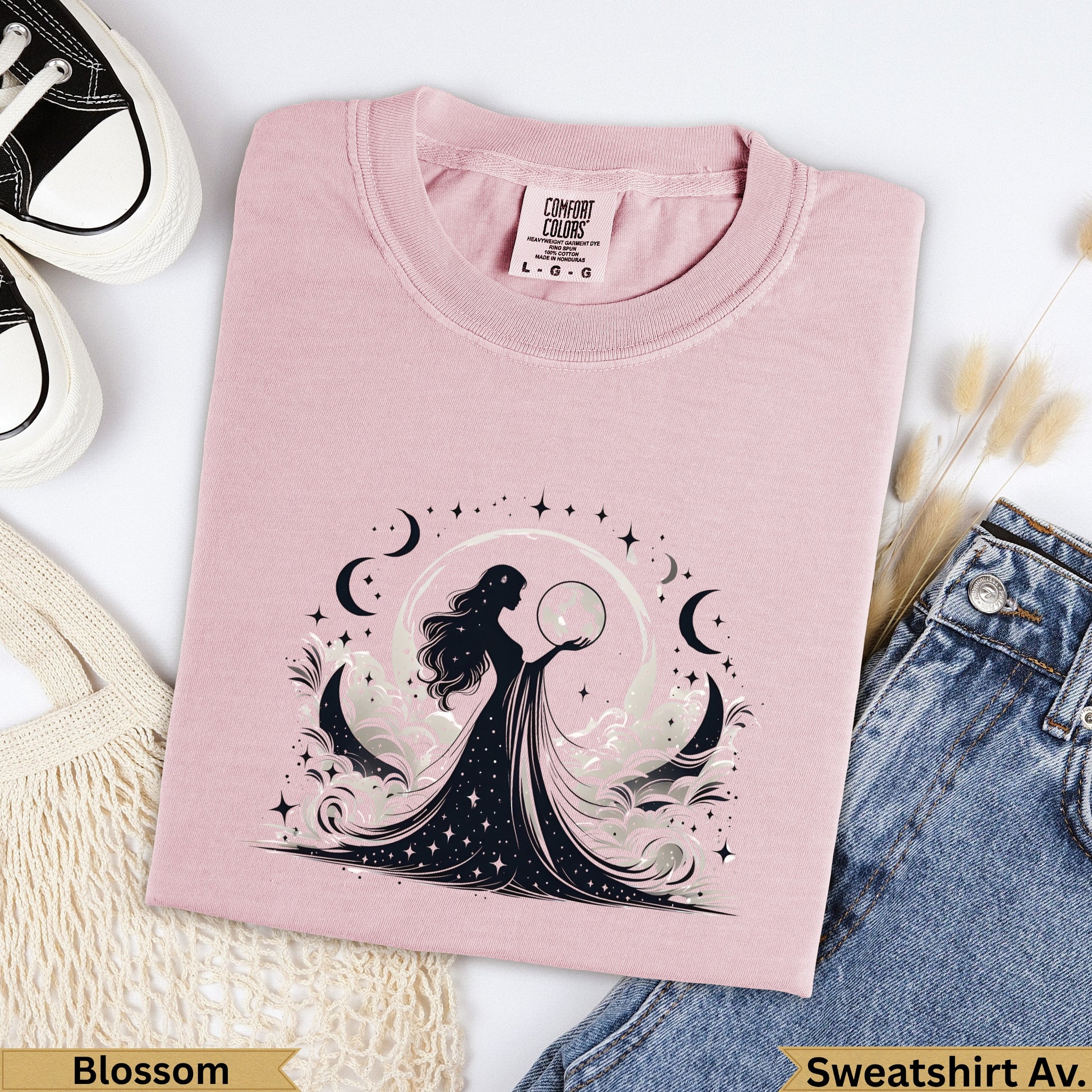 Pink t-shirt with celestial goddess graphic and moon phases.