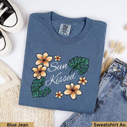 Blue t-shirt with "Sun Kissed" text and floral design.