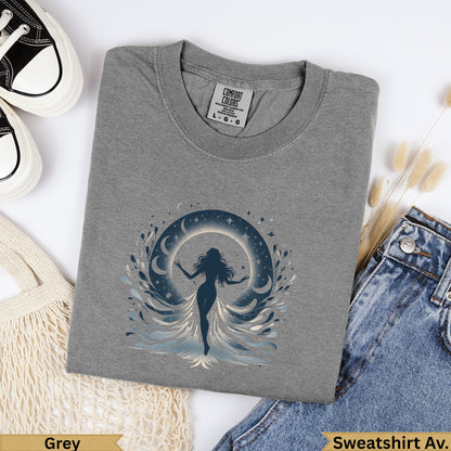 Grey t-shirt with celestial woman graphic, dark blue moons, and waves.