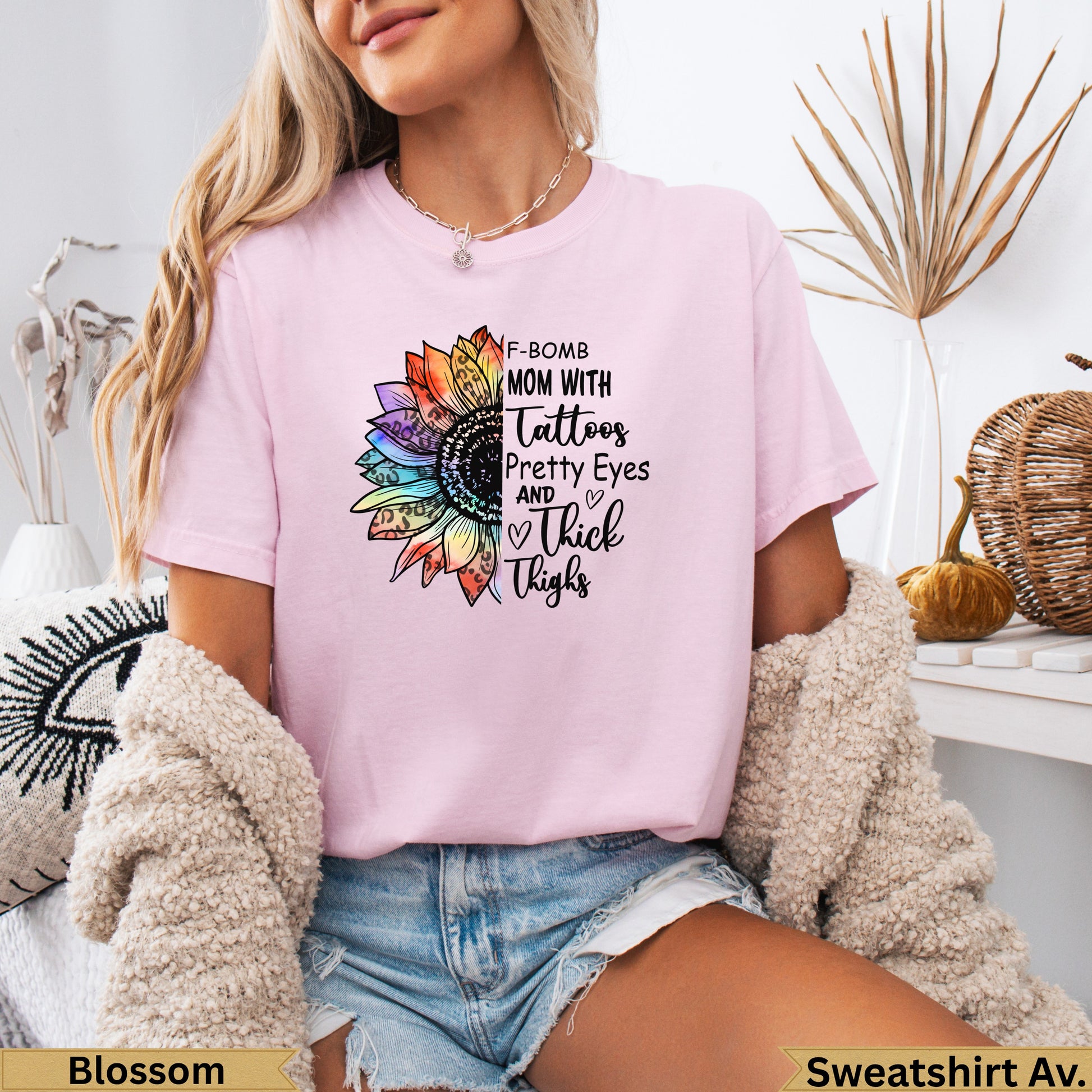 Pink sweatshirt with "F-BOMB MOM" text and a floral graphic.
