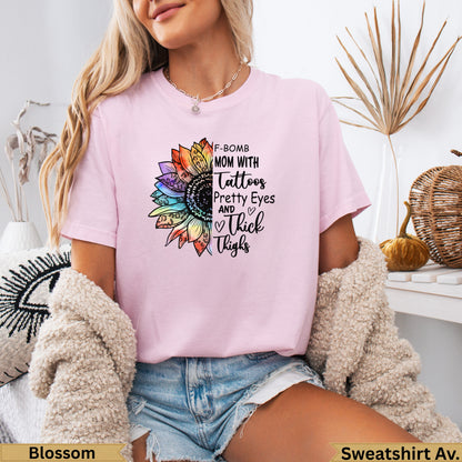 Pink sweatshirt with "F-BOMB MOM" text and a floral graphic.