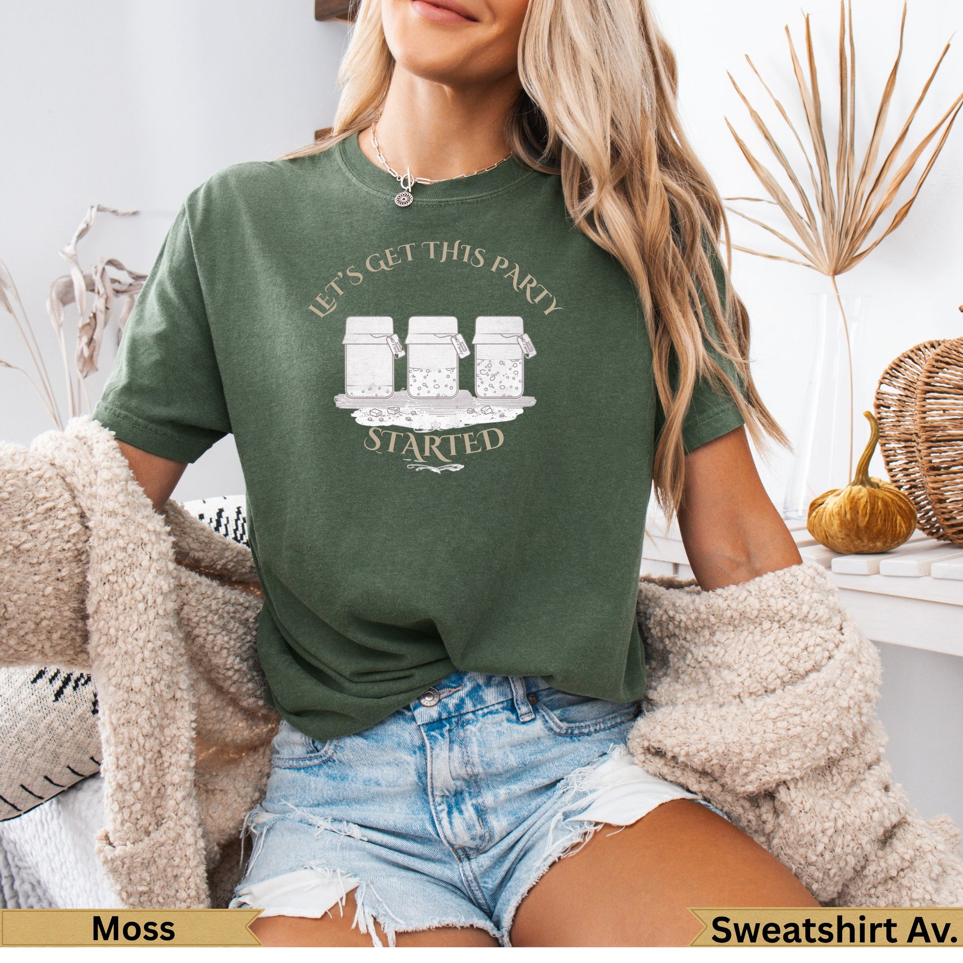 Green t-shirt with "Let's Get This Party Started" text over mason jars.