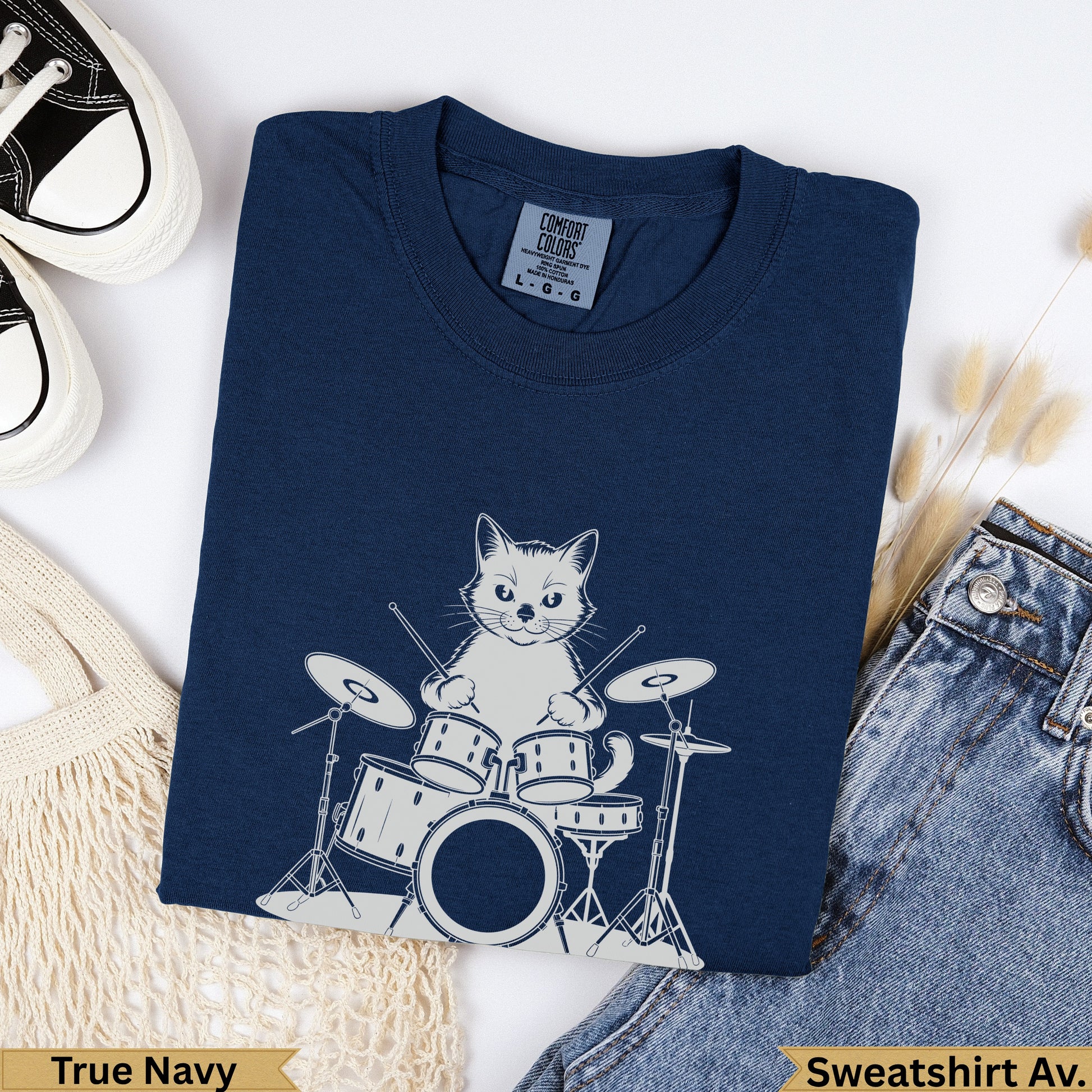 Navy blue sweatshirt with a cartoon cat playing drums graphic.