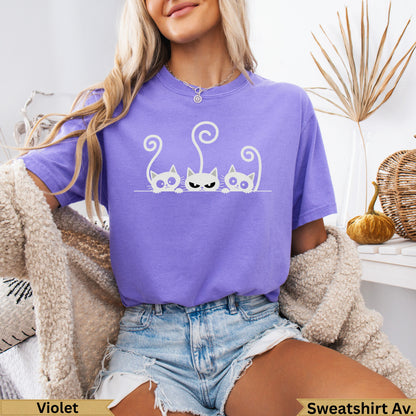 Purple t-shirt with three white cartoon cats and "Violet" and "Sweatshirt Av." text.