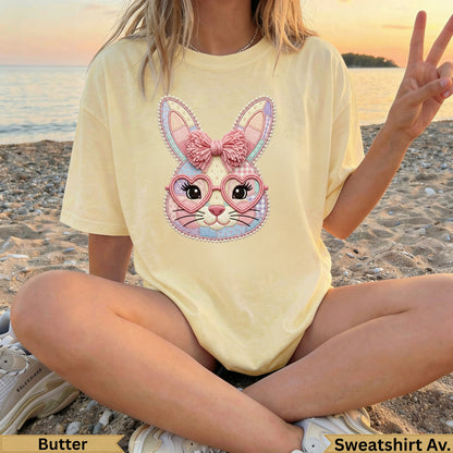 Yellow t-shirt with a pink bunny graphic wearing heart-shaped glasses.