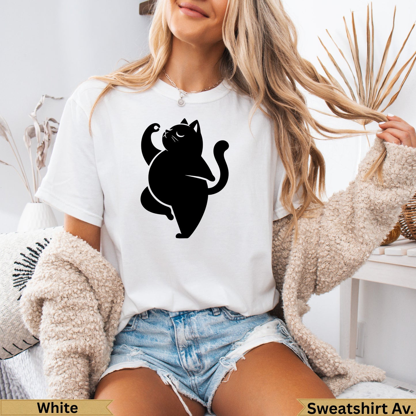 Black cat silhouette in a yoga pose on a white t-shirt.