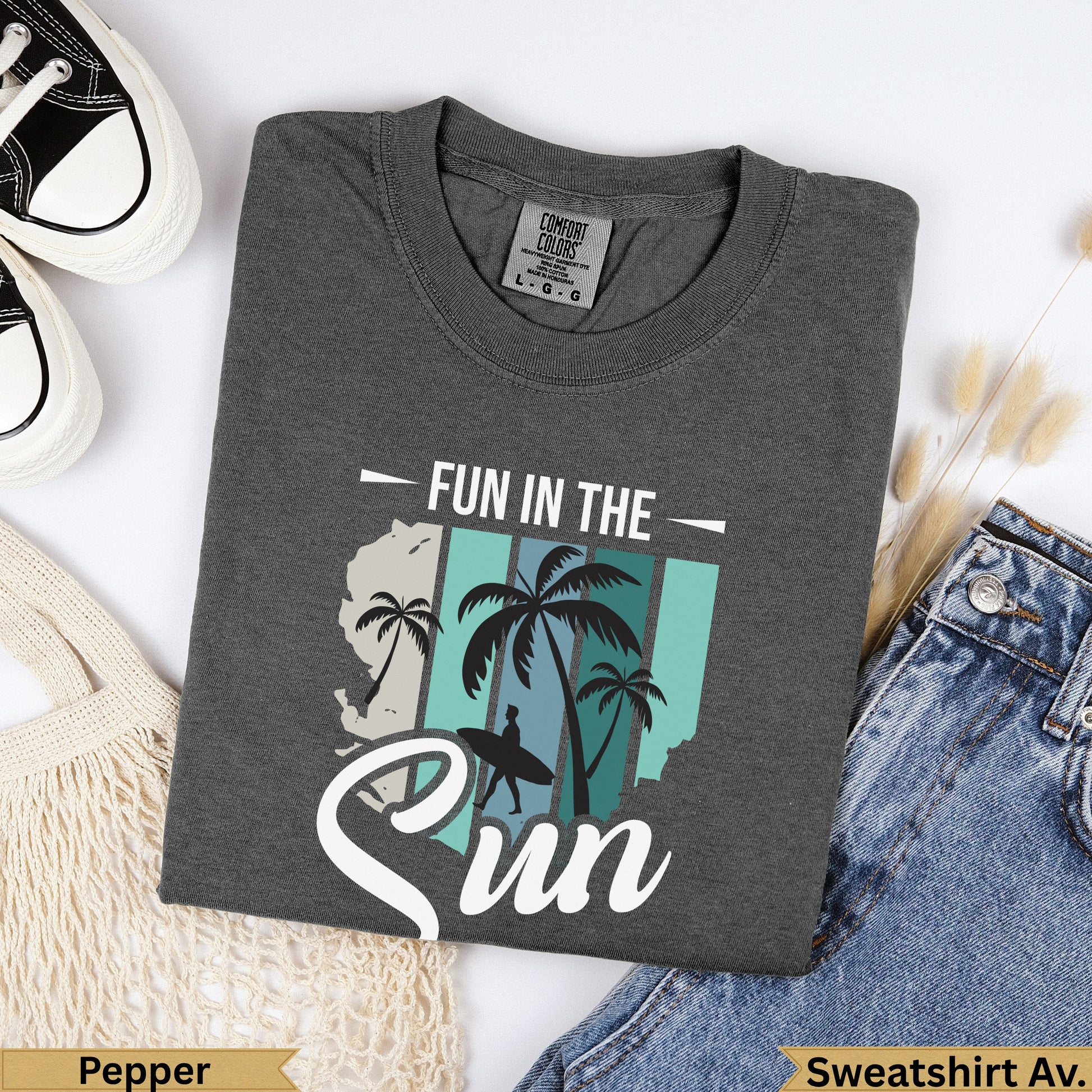 Dark gray t-shirt with "Fun in the Sun" text and palm tree graphic.