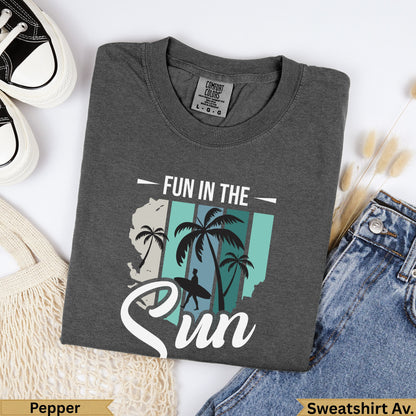 Dark gray t-shirt with "Fun in the Sun" text and palm tree graphic.