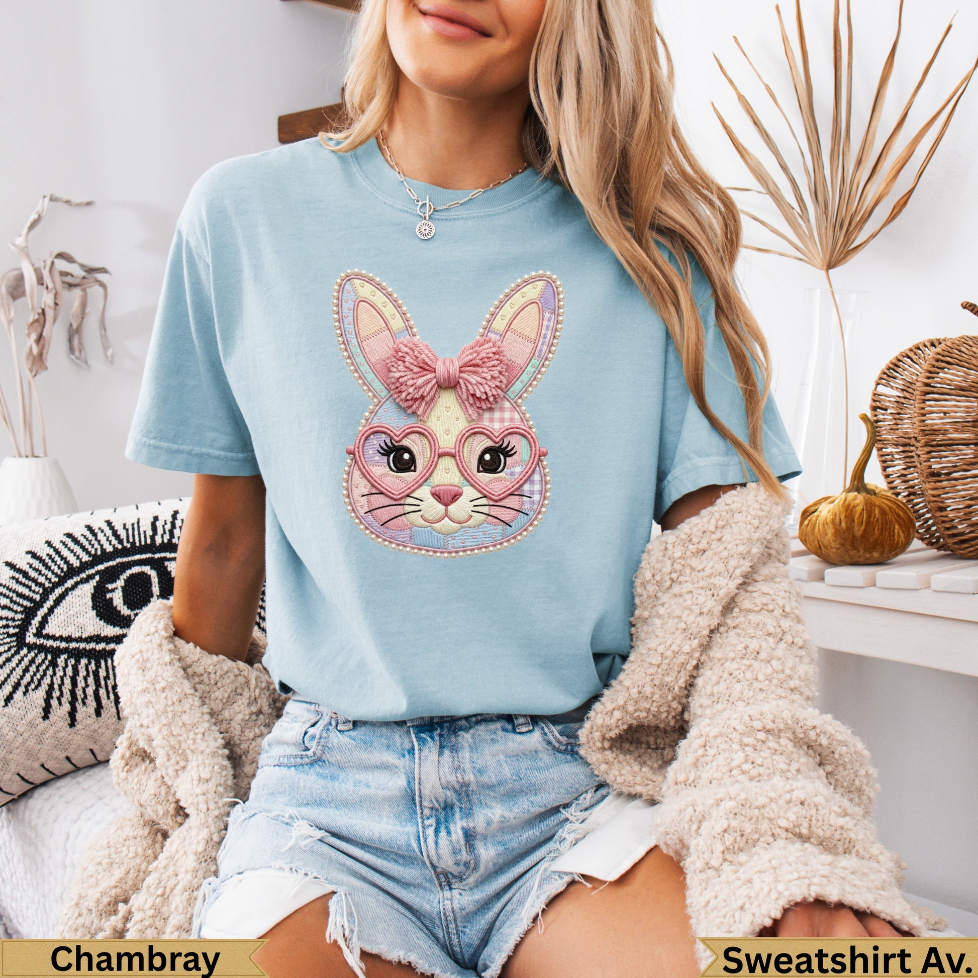 Light blue t-shirt with pink plaid Easter bunny graphic and heart-shaped glasses.