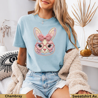 Light blue t-shirt with pink plaid Easter bunny graphic and heart-shaped glasses.