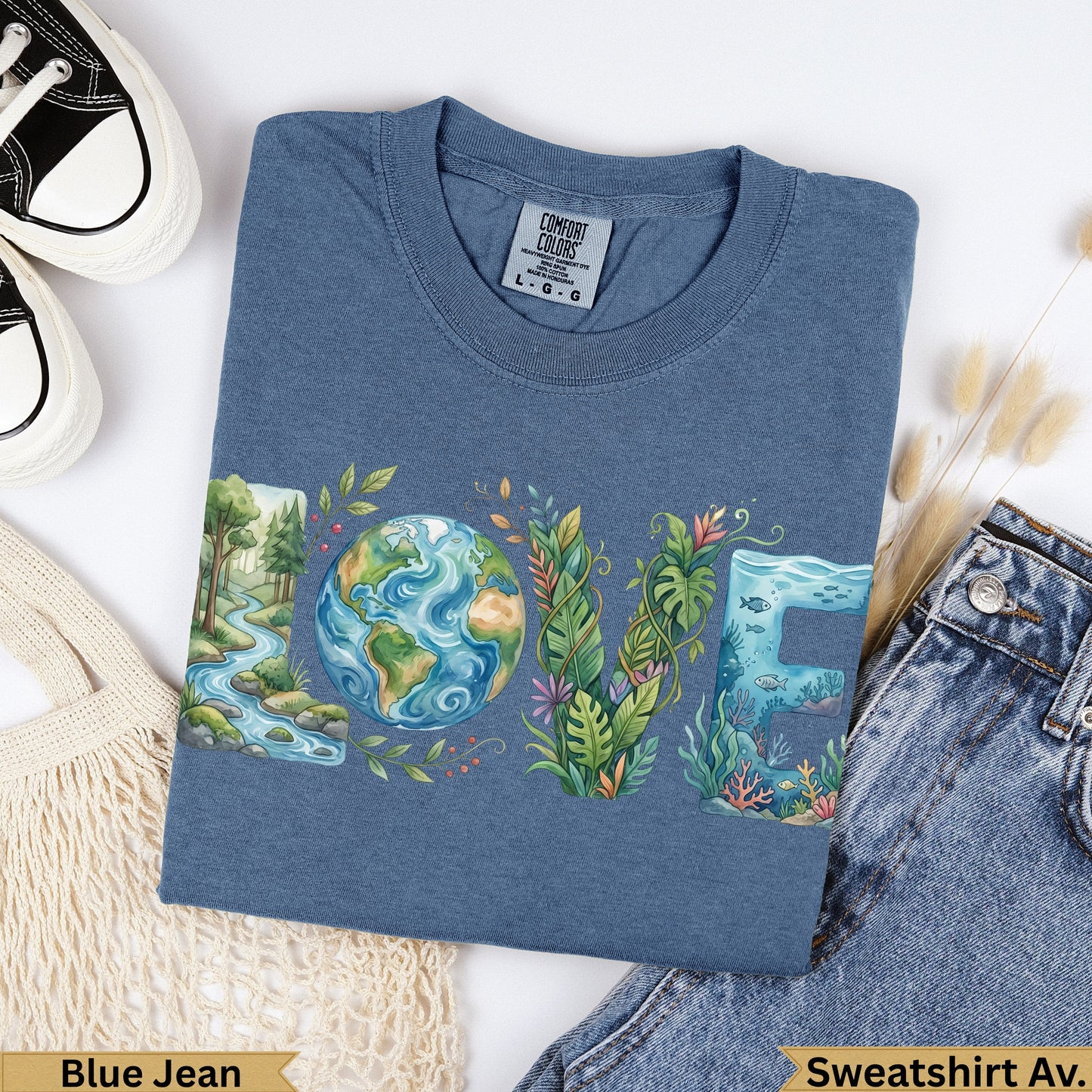Blue sweatshirt with "LOVE" design featuring nature scenes and the Earth.