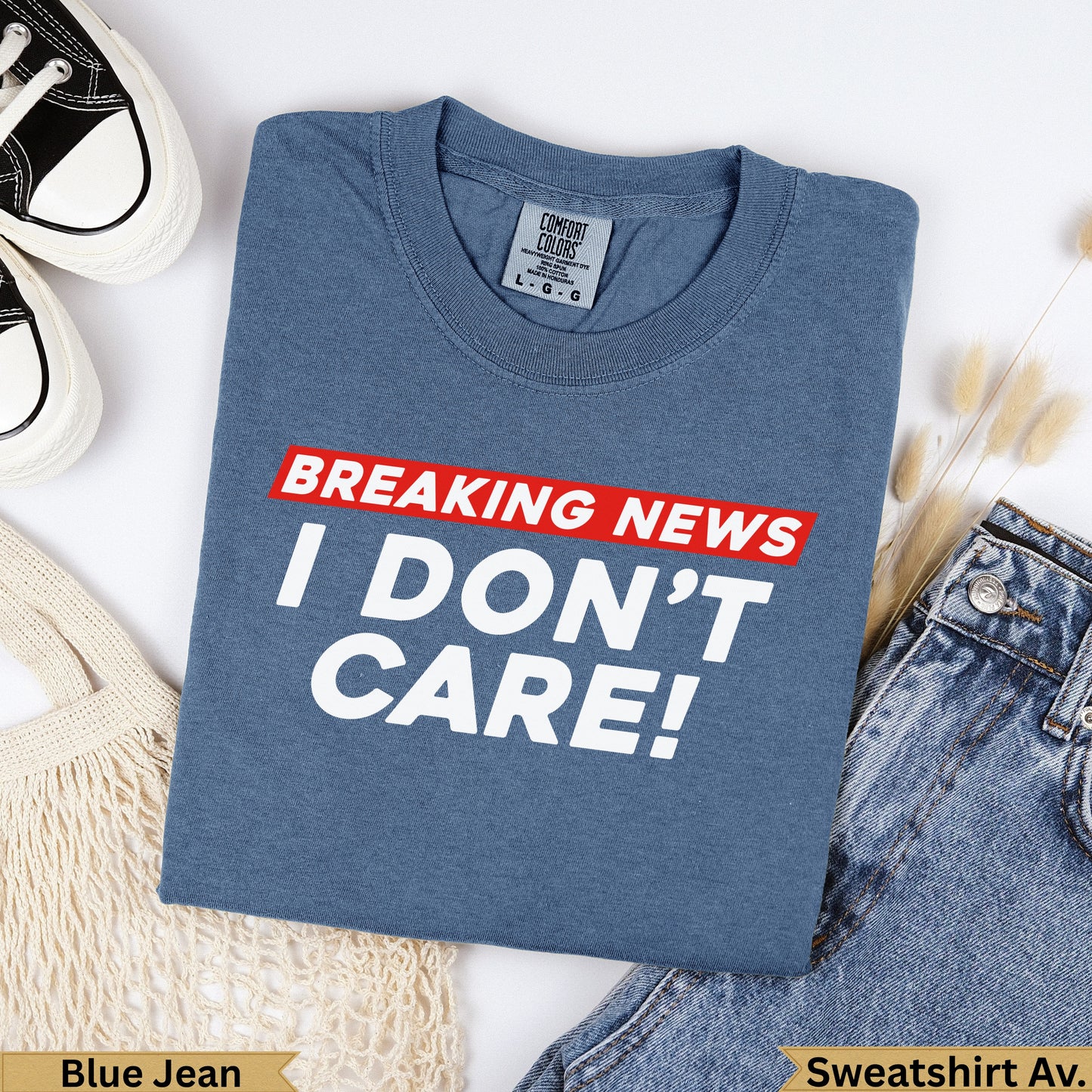 Blue Jean Comfort Colors sweatshirt with "BREAKING NEWS I DON'T CARE!" text.