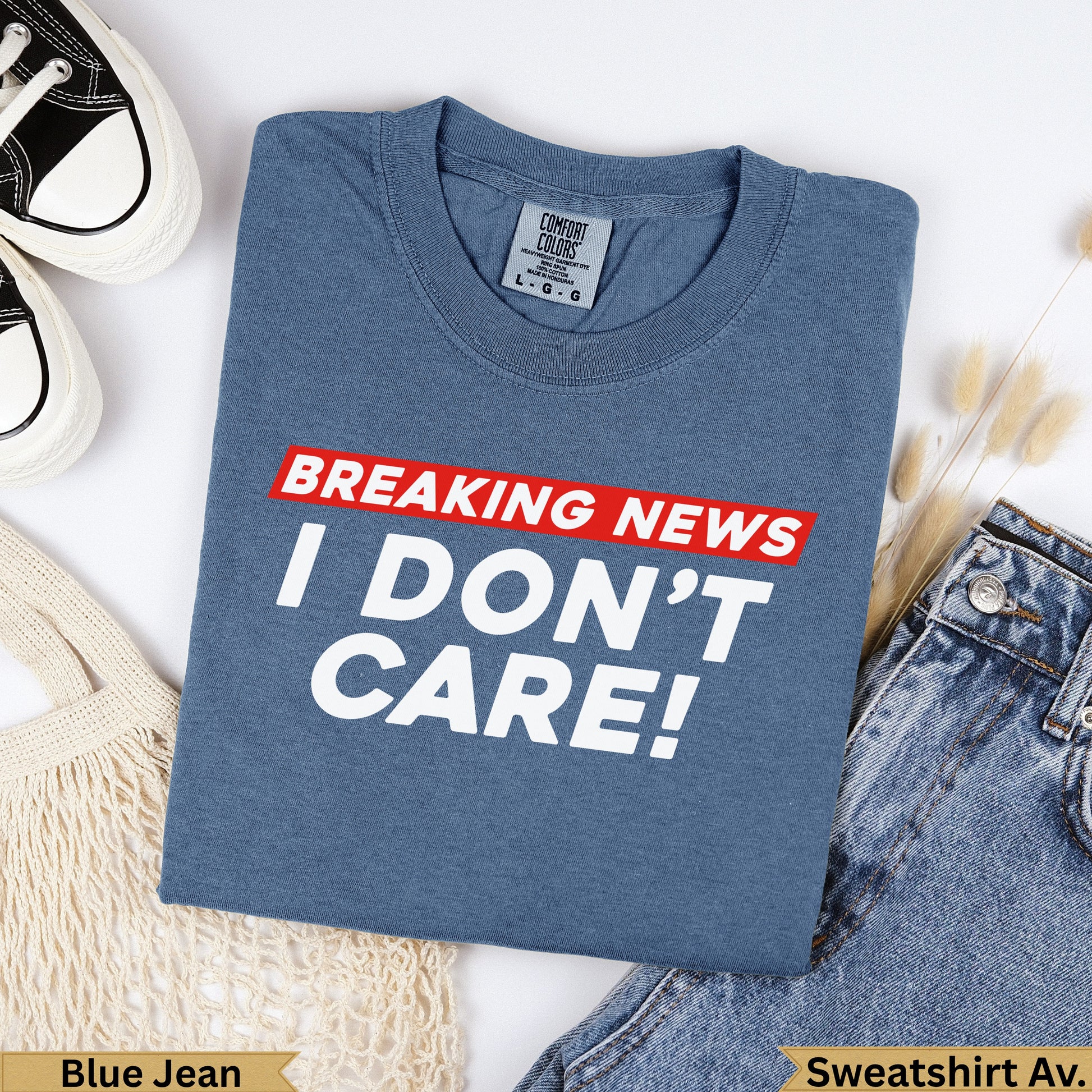 Blue Jean Comfort Colors sweatshirt with "BREAKING NEWS I DON'T CARE!" text.