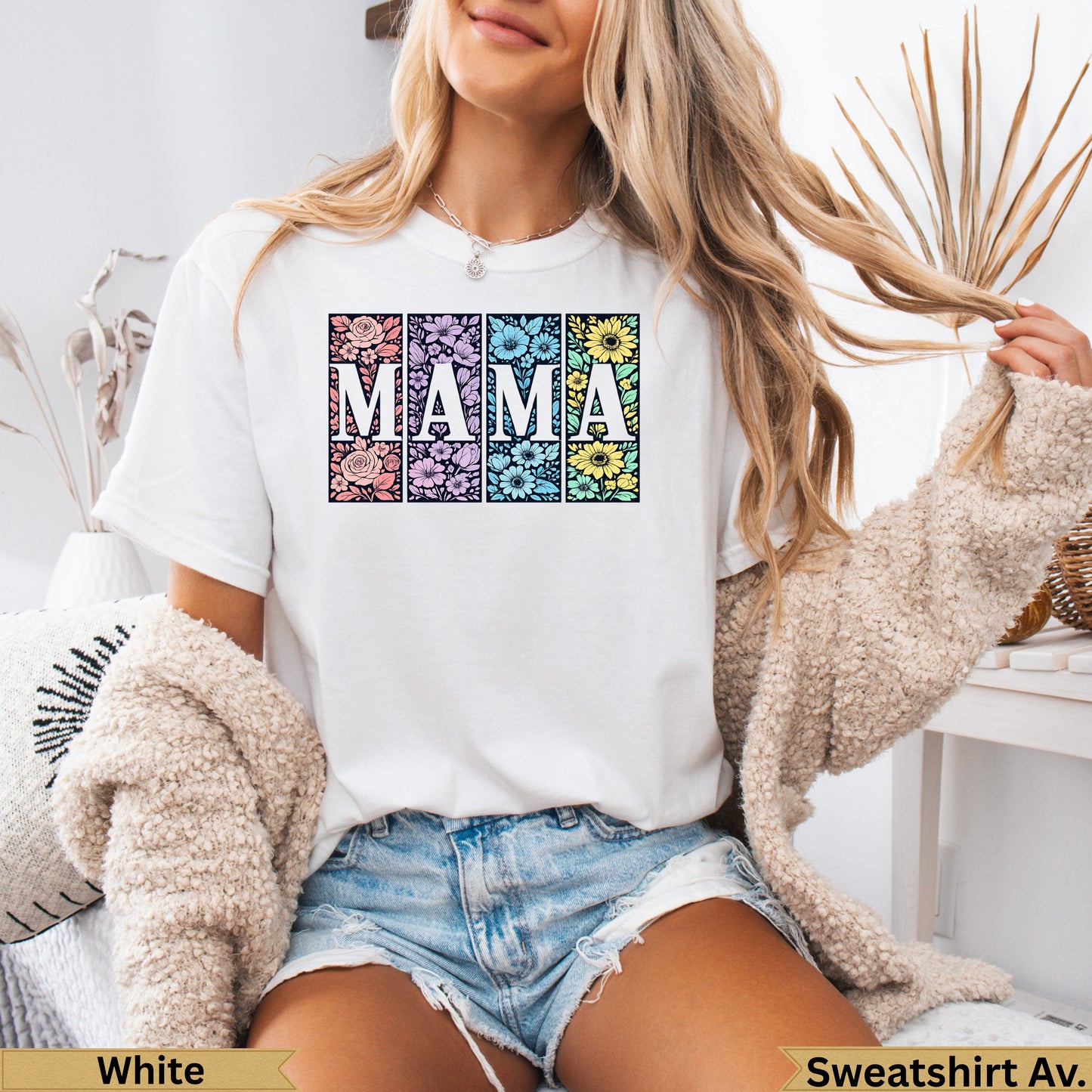 White t-shirt with "MAMA" in floral patterned squares.