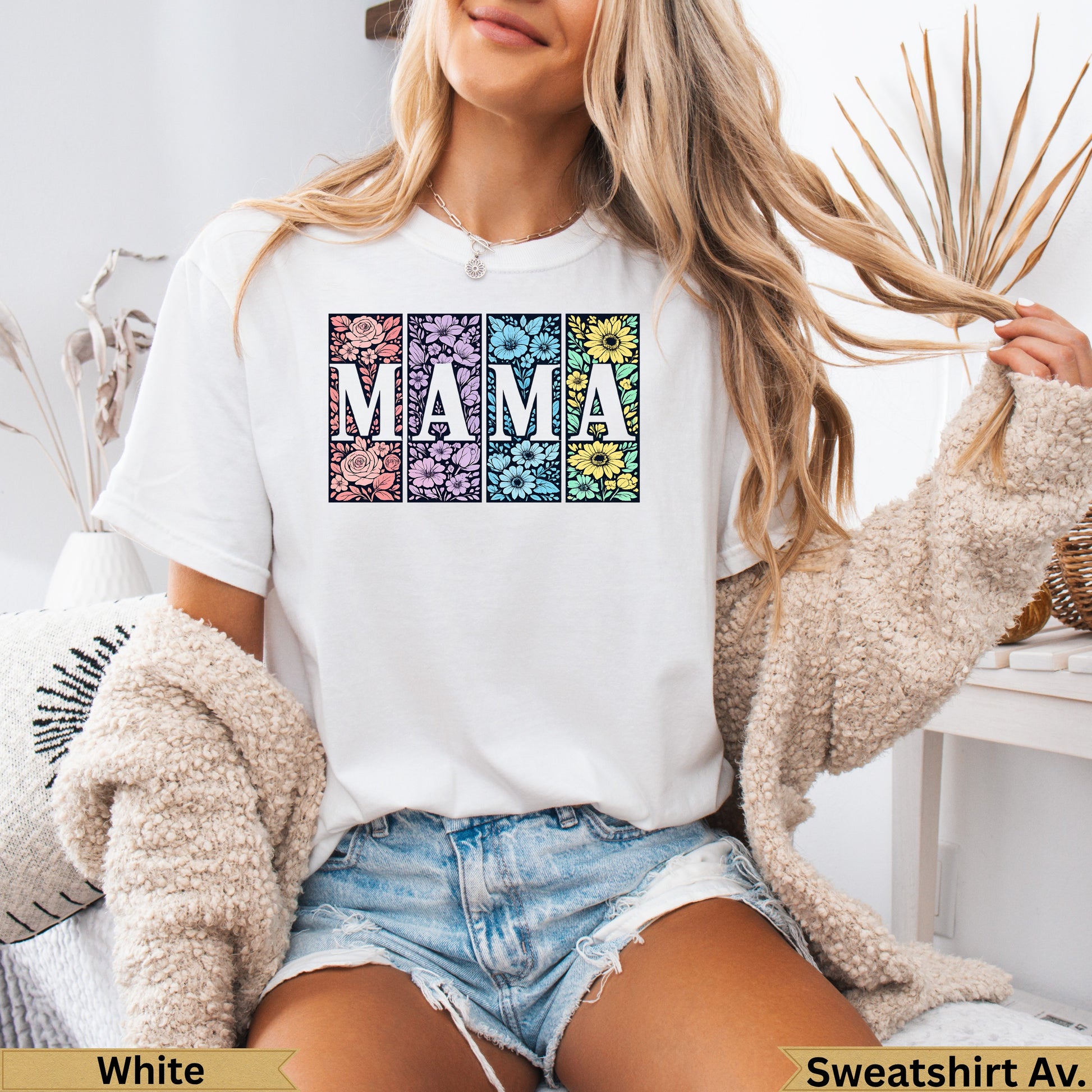 White t-shirt with "MAMA" in floral patterned squares.