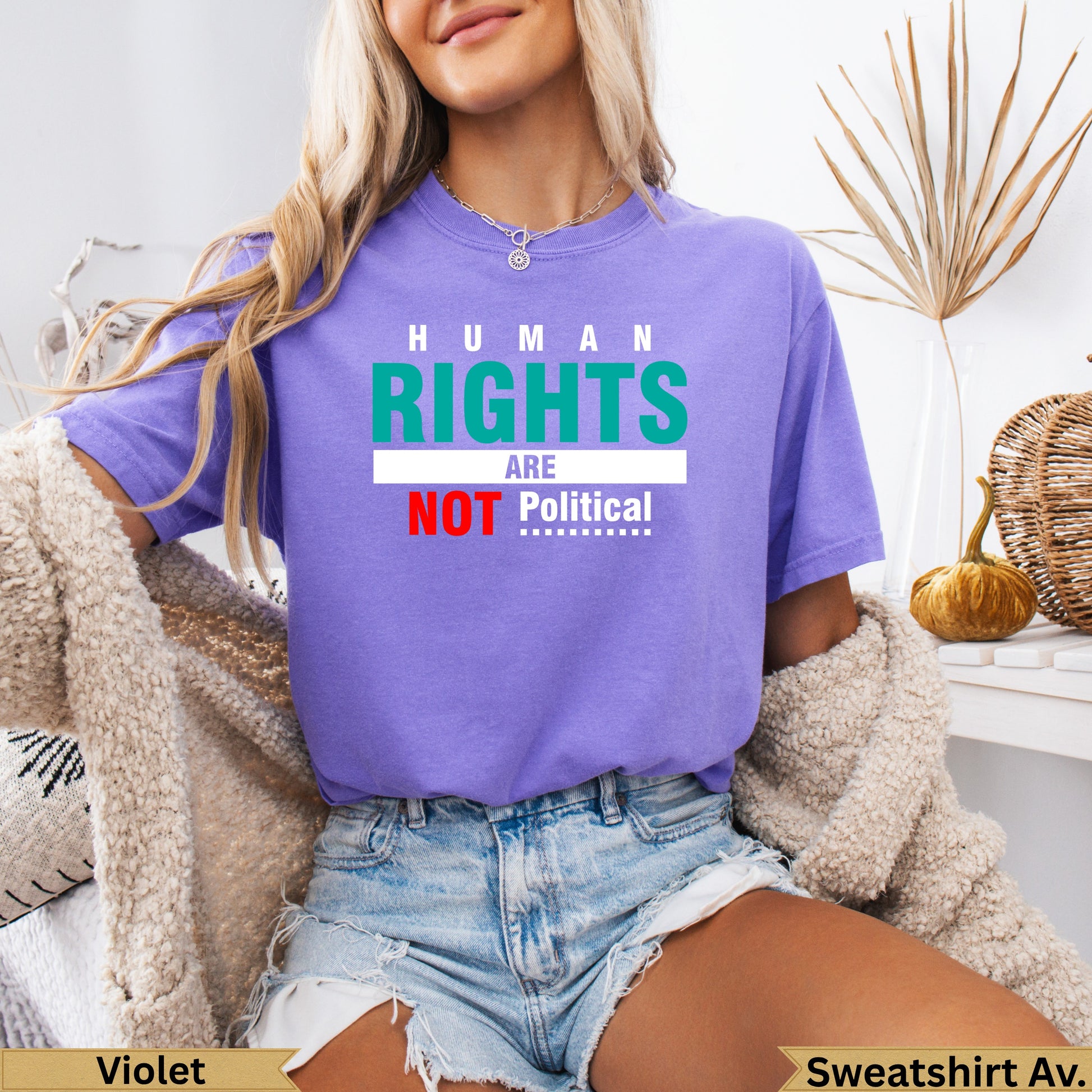 Purple t-shirt with "HUMAN RIGHTS are NOT Political" text.
