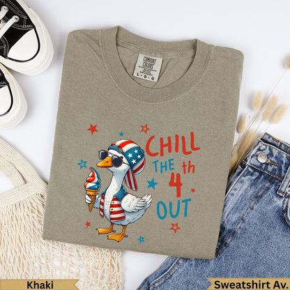 Khaki t-shirt with a cartoon duck wearing sunglasses and holding an ice cream cone, text reads "CHILL THE 4th OUT".