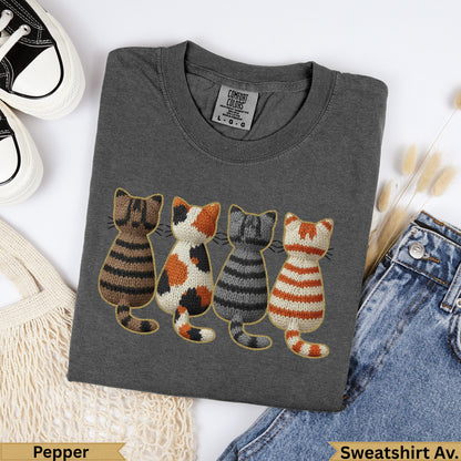 Dark gray sweatshirt with embroidered row of four cats: striped, calico, striped, striped.