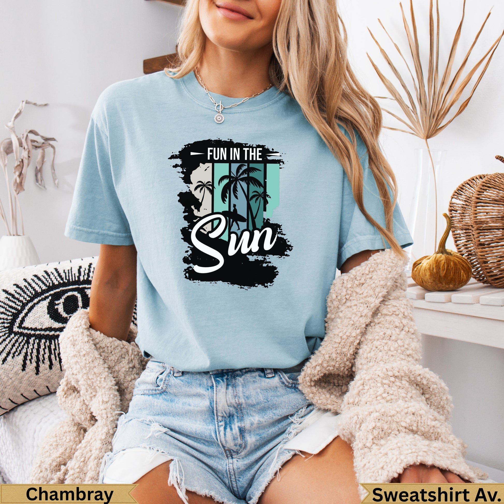 Light blue t-shirt with "FUN IN THE SUN" text and a palm tree silhouette.