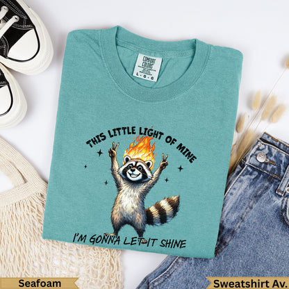 Raccoon with flames on head and peace signs, text "This Little Light of Mine I'm Gonna Let It Shine".