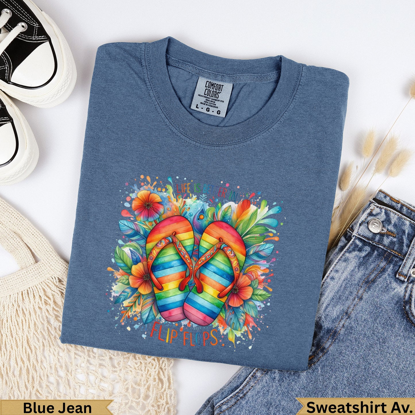 T-shirt with rainbow flip flops and floral graphic.
