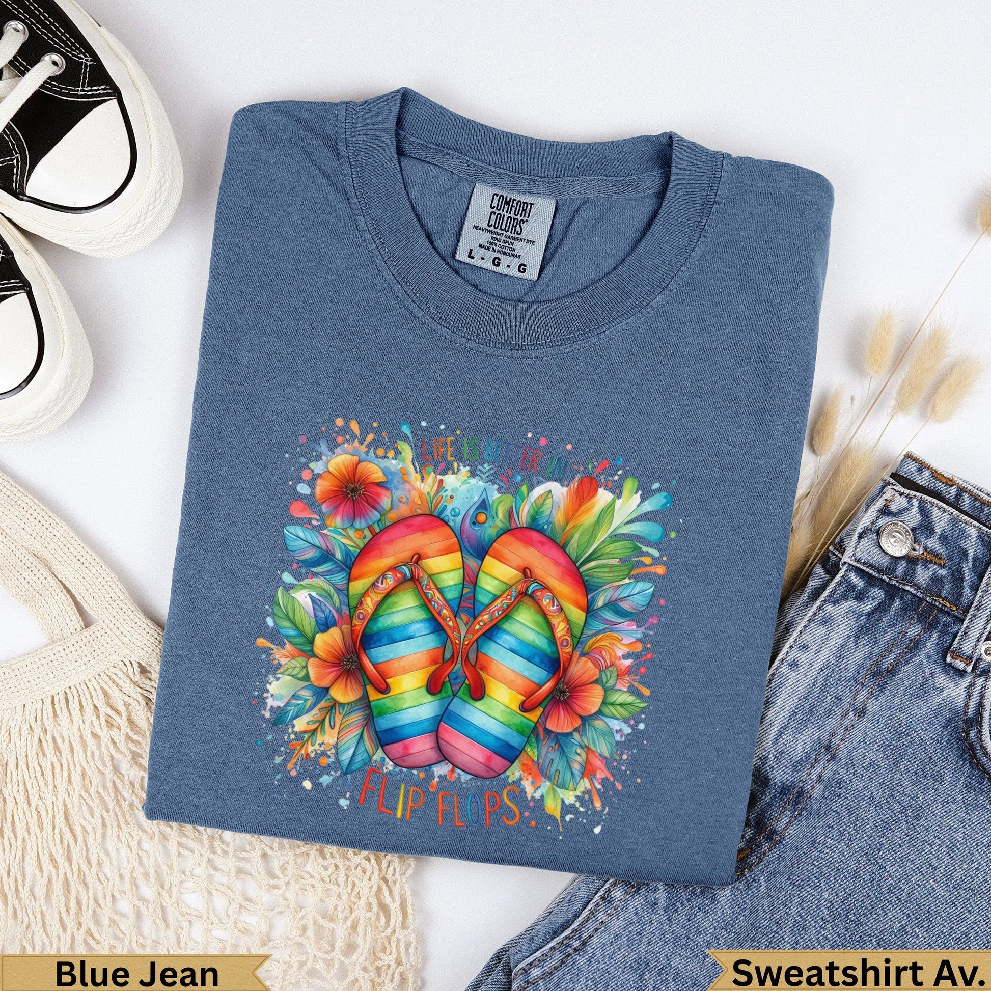 T-shirt with rainbow flip flops and floral graphic.