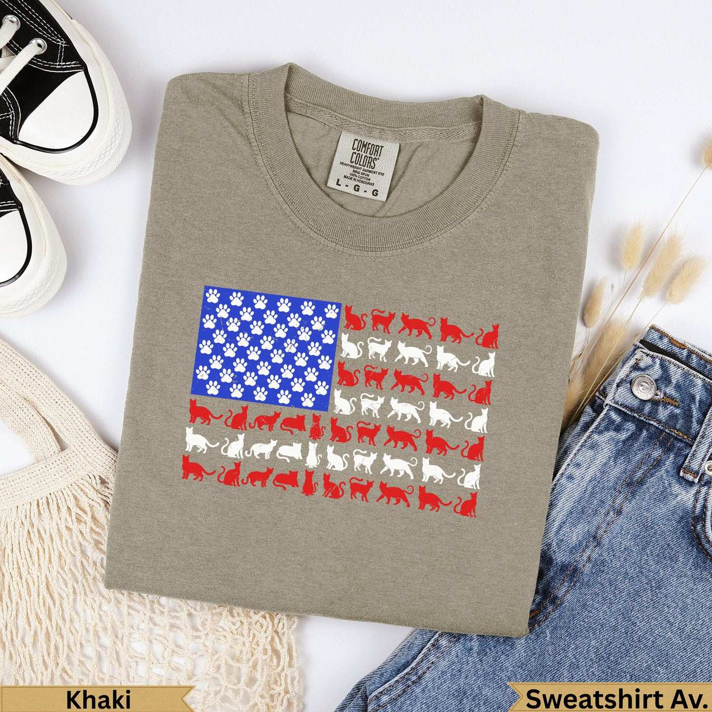 Khaki crewneck sweatshirt with an American flag design made of cats and paw prints.