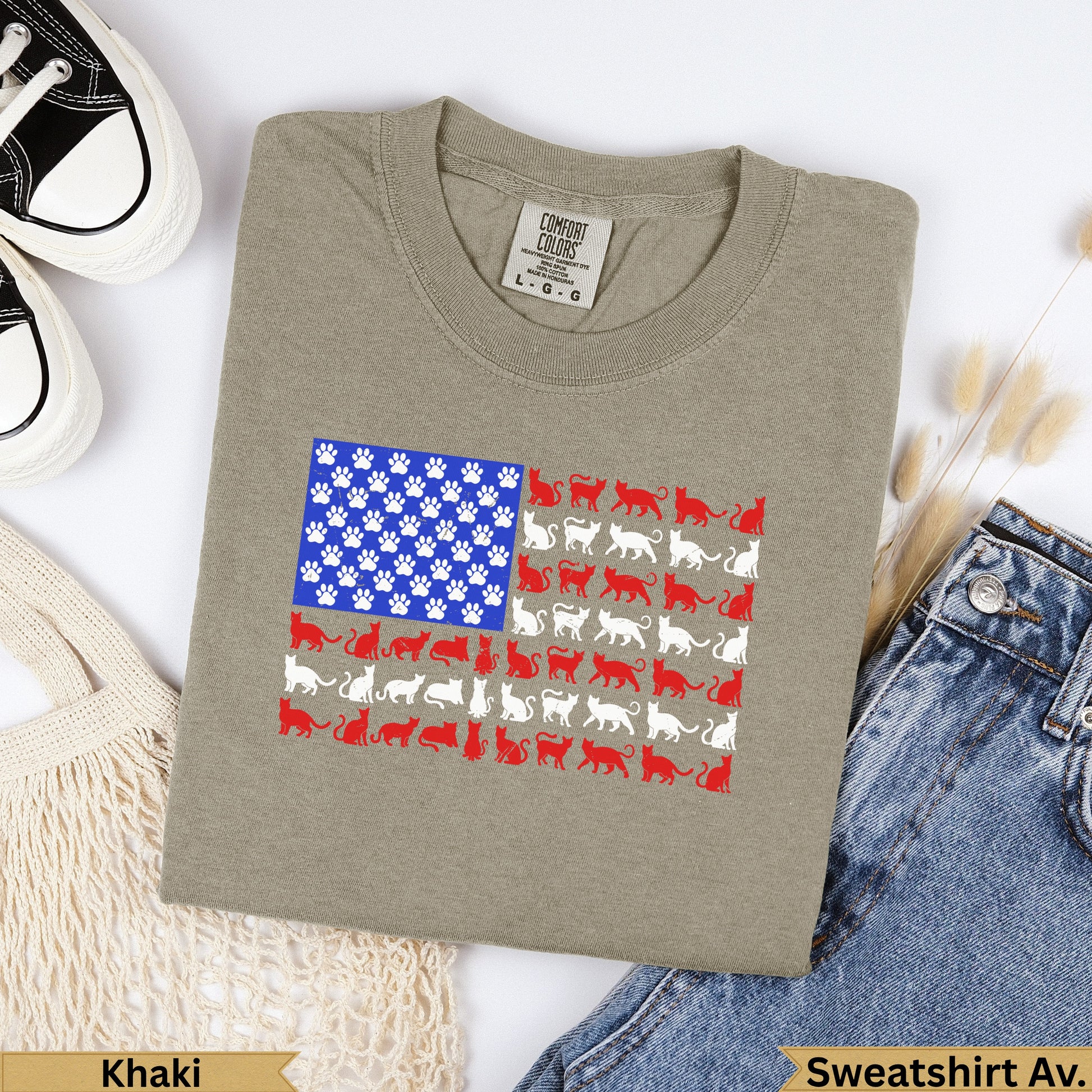 Khaki crewneck sweatshirt with an American flag design made of cats and paw prints.