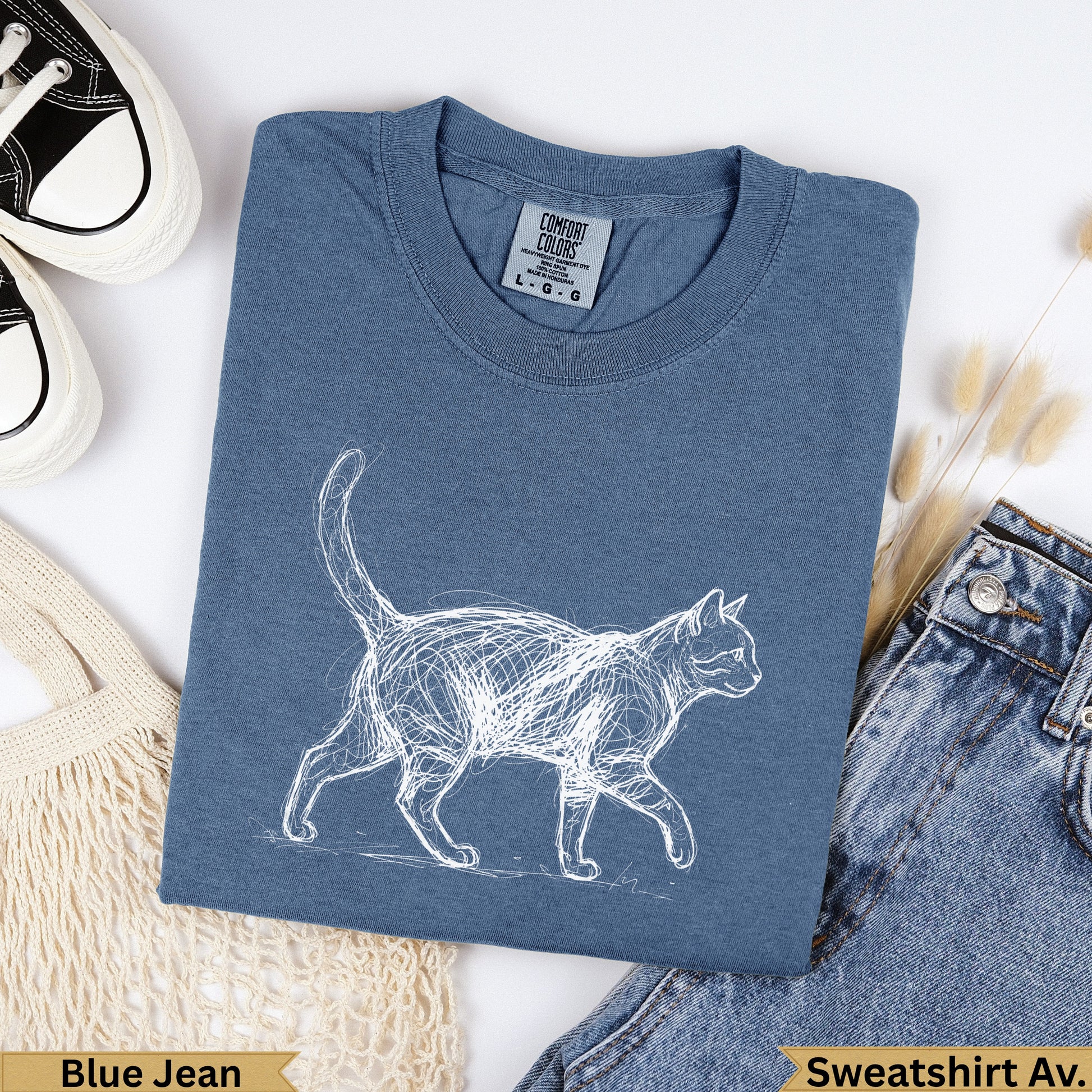 Blue Jean Comfort Colors sweatshirt with a white sketch of a walking cat.