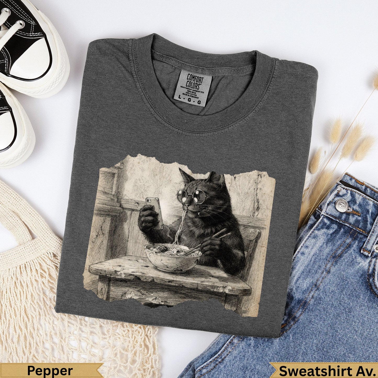 Charcoal t-shirt with vintage cat wearing glasses eating noodles graphic.