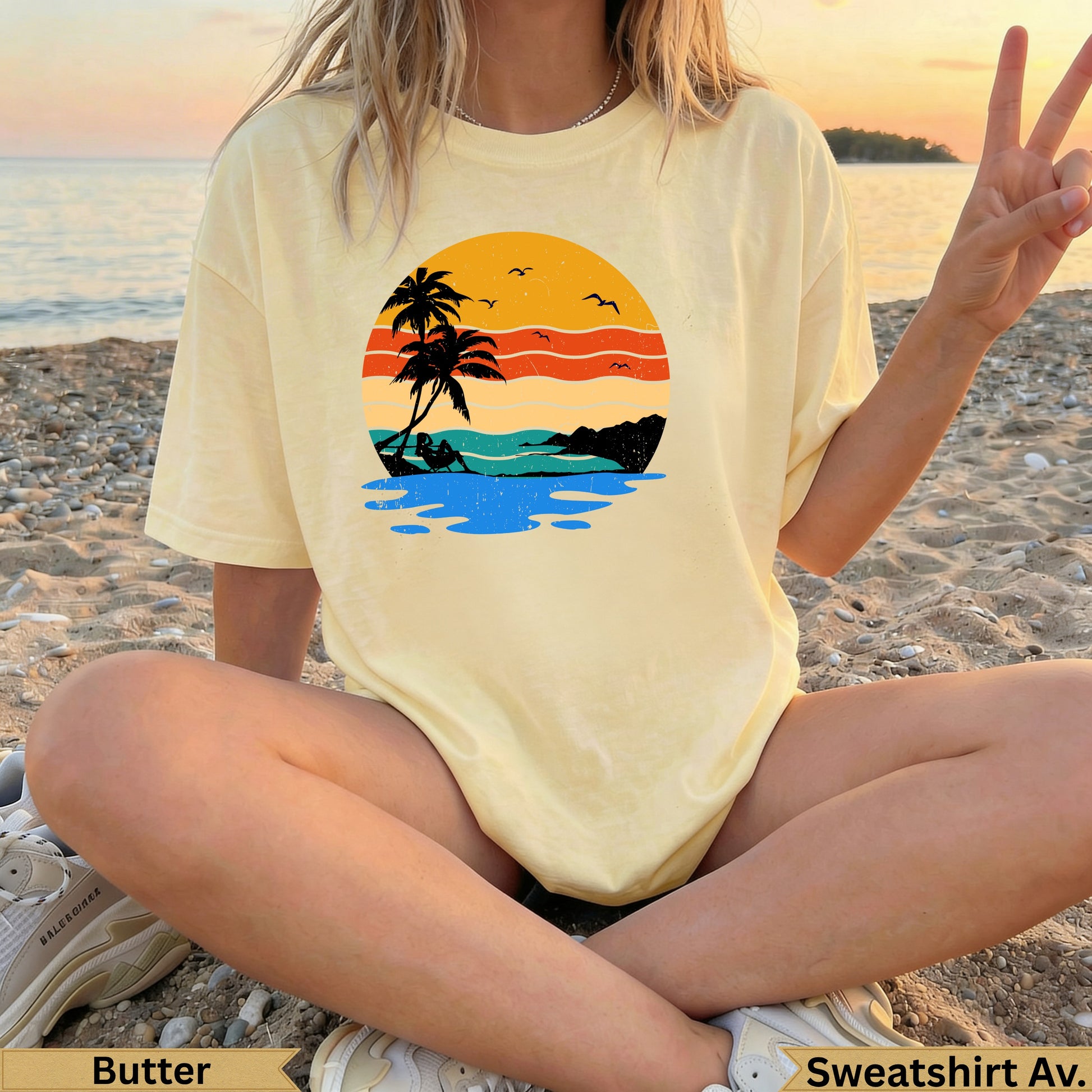 Yellow t-shirt with a retro sunset beach graphic and palm trees.