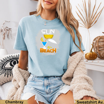 Light blue t-shirt with "Sun of a Beach" graphic featuring a cocktail and umbrella.