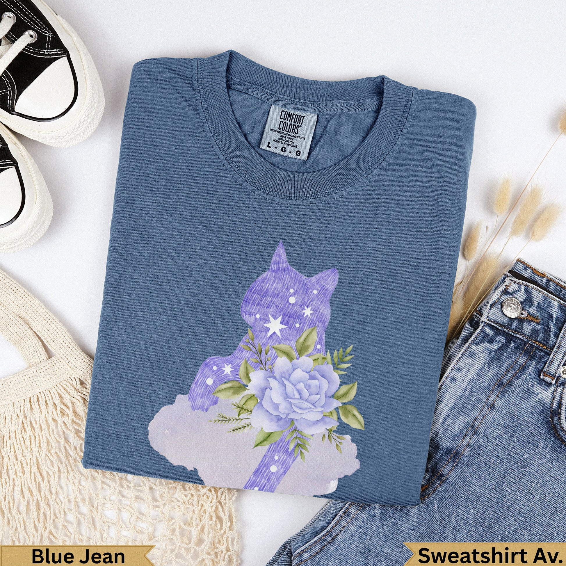 Blue Jean sweatshirt with purple floral cat silhouette and stars.