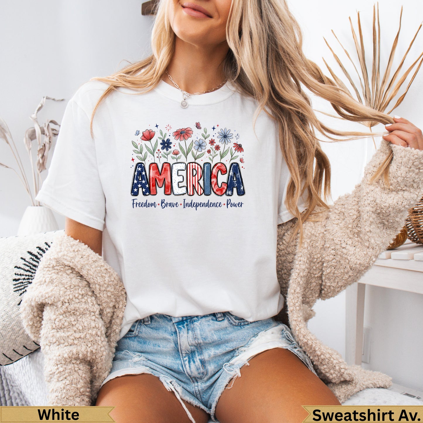 White t-shirt with "AMERICA" text and floral design, women's sizes.