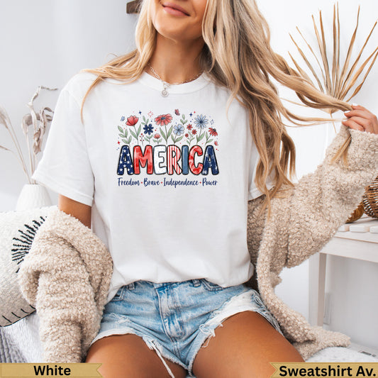 White t-shirt with "AMERICA" text and floral design, women's sizes.