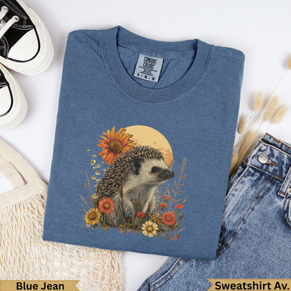Hedgehog with flowers and moon graphic on blue jean Comfort Colors sweatshirt.