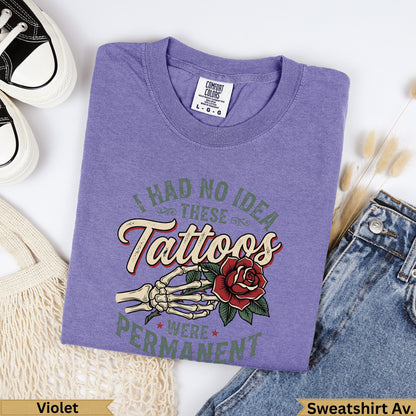Purple graphic t-shirt with skeleton hand holding a rose and text.