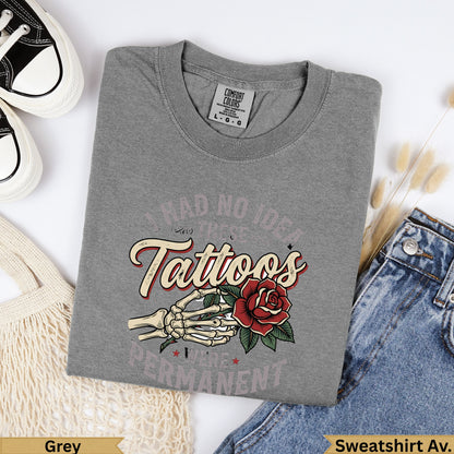 Grey t-shirt with "I Had No Idea Tattoos Were Permanent" text and skeleton hand holding rose.