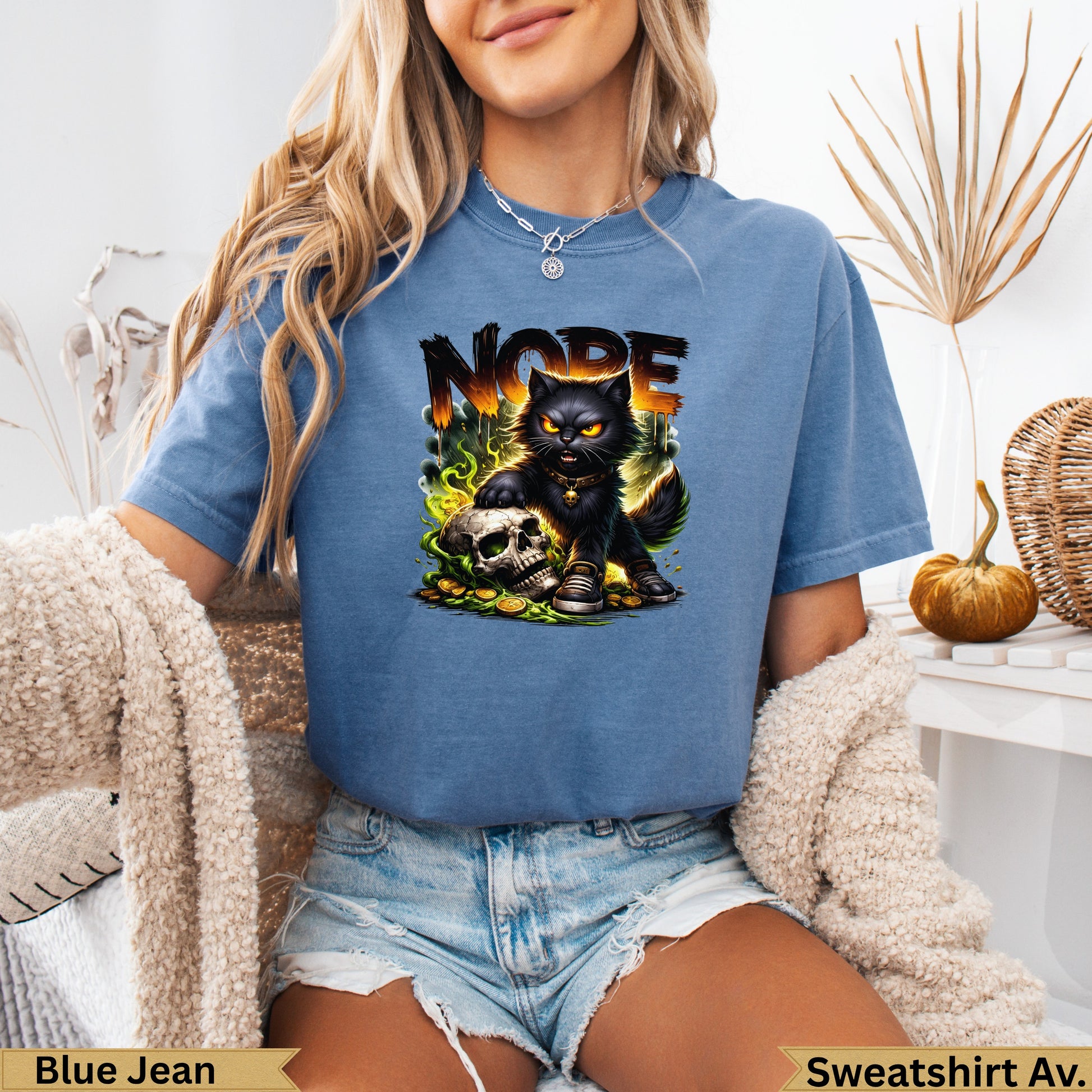 Blue t-shirt with "NOPE" text, black cat, skull, and coins graphic.