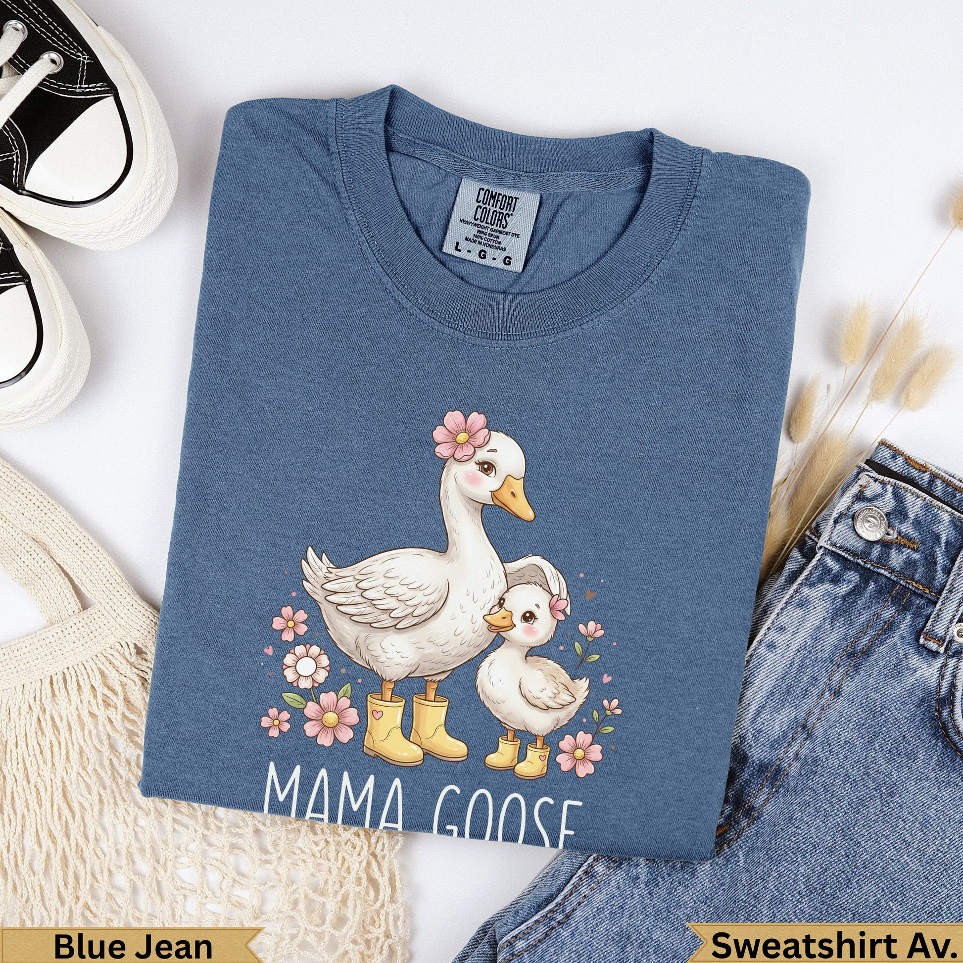 Blue Jean Mama Goose sweatshirt with floral details and two geese.