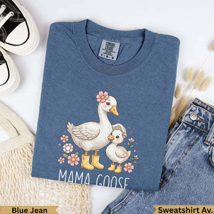 Blue Jean Mama Goose sweatshirt with floral details and two geese.