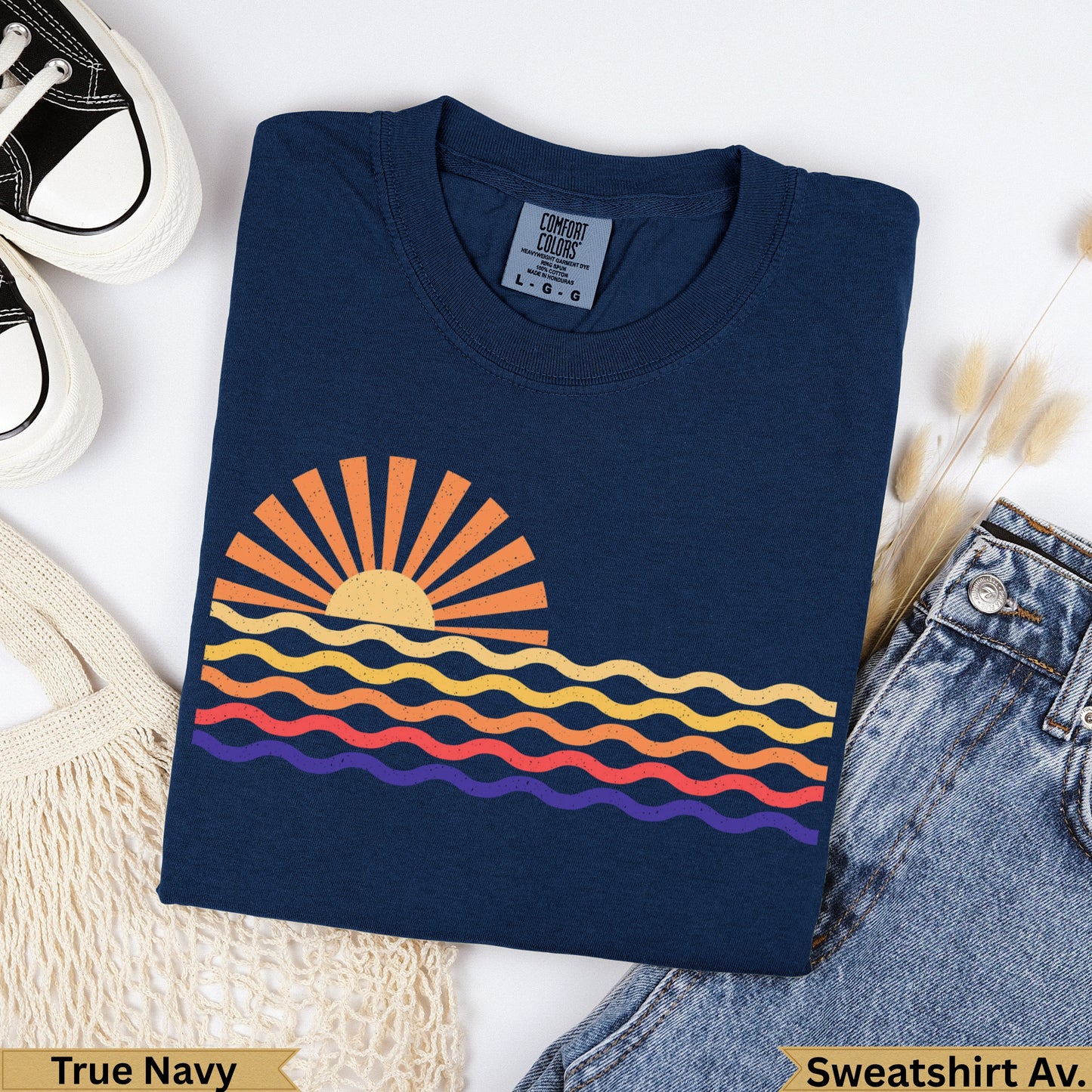 Navy t-shirt with a colorful sunset graphic and "True Navy" text.