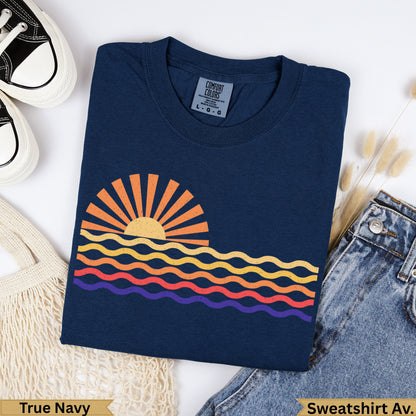 Navy t-shirt with a colorful sunset graphic and "True Navy" text.