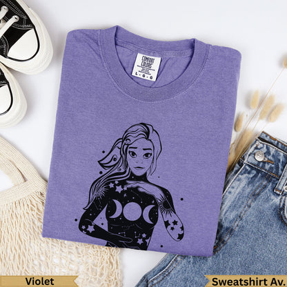 Purple Comfort Colors sweatshirt with celestial moon phase arm tattoo design.