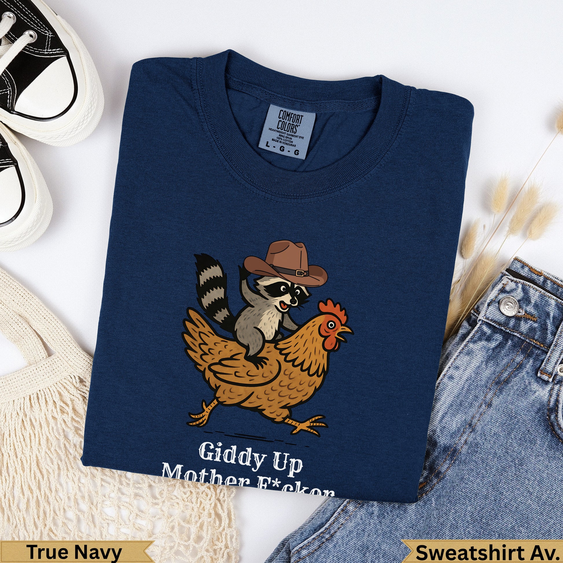 Navy cotton t-shirt with raccoon on chicken, "Giddy Up Mother F*ckon" text.